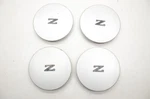84-89 Nissan 300ZX Z31 2+0 Set Of Silver Wheel Center Caps 4031721P00. Fixed Price $179.99.