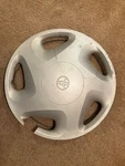 One 1997-2000 Toyota Tacoma # 61100 14" Hubcap / Wheel Cover 42621-AD020. Fixed Price $38.00.