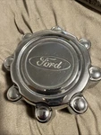 One Factory 1999 2005 Ford F250 Excursion Center Hubcap F8TA-1A096-BB. Fixed Price $34.99.