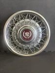 One Genuine 1986 To 1992 Cadillac Fleetwood Brougham Wire Spoke Locking Hubcap. Fixed Price $94.00.