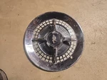 1959 Dodge Lancer 4-BAR Flipper Hubcap. Fixed Price $125.00.