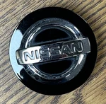 1/8" Nissan 370Z, Altima, Gt-r, Juke Black Center Cap #40342-BR01A-B1. Fixed Price $19.99.