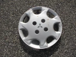 One Factory 1994 1996 Mitsubishi Expo 14 Inch Hubcap Wheel Cover Blemished. Fixed Price $15.00.