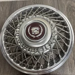 1-ONLY, 1985 Cadillac Wire Hubcap, #2047-A- Fwd- 14 (dent) #Q4. Fixed Price $70.00.