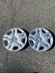 Genuine 2010 To 2012 Nissan Versa 15 Inch Hubcaps Wheel Covers Scratched. Fixed Price $32.00.