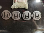 Oe Genuine Honda Charcoal Center With Black Logo CAP8364 44732-T2A-A01. Fixed Price $75.00.