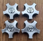 Toyota Solara Center Cap Set Of 4, 1999-2003, Metal Clip, Part Number 69378 Ss. Fixed Price $54.95.