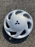 One Genuine 1994 To 1996 Mitsubishi Mirage 13 Inch Hubcap Wheel Cover. Fixed Price $33.00.