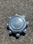 One Factory 1999 2005 Ford F250 Excursion Center Hubcap F8TA-1A096-BB. Fixed Price $24.20.