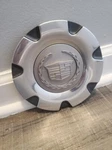 2004 Cadillac Crx Wheel Center PN#9594807. Fixed Price $15.00.
