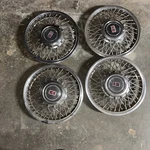 (4) Four -late 1990-1993 Oldsmobile 14" Wire Hubcap / Wheel Covers Used Set. Fixed Price $139.00.