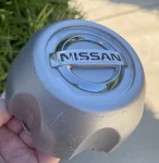Nissan Frontier / Xterra Wheel Center Cap 40315-1Z800 Chrome Emblem 1998-2004. Fixed Price $49.00.