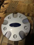 Ford Focus Center Cap (B9162) 98AB-1130-CB. Fixed Price $25.99.