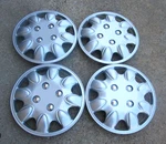 12" Aftermarket Pop On Hubcaps Wheel Covers. Fixed Price $60.00.