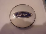 Nos Oem Ford Wheel Center E7DZ-1141-C Measures 1/4". Fixed Price $18.00.