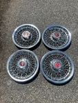 Factory 1978 1981 Pontiac Lemans Grand Prix 14 Inch Wire Spoke Hubcaps. Fixed Price $110.00.