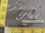 Grand Prix By Pontiac Circa '73 Rear Emblem 499836 5141. Fixed Price $40.00.