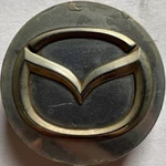 Mazda Silver Chrome Wheel Center Cap NC76 37190 78F58881. Fixed Price $12.99.