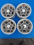 Oldsmobile Rally Wheels 14X6 Set. Fixed Price $1295.00.