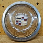 One 1981-1985 Cadillac Eldorado Seville 15" Wire Hubcap Center Gold. Fixed Price $24.95.