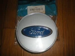 Nos 1987-1991 Ford Taurus Wheel Center Ornament E7DZ-1141-C. Fixed Price $14.99.
