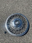 One Factory 1992 Buick Lesabre Regal 15 Inch Wire Spoke Locking Hubcap Dented. Fixed Price $40.00.
