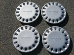 Genuine 1986 To 1994 Ford Taurus 14 Inch Hubcaps Wheel Covers Mint. Fixed Price $88.00.