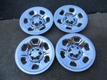 15" Set Of Four (4) Chrome Skins 2005-2010 Nissan Frontier 6 Spoke Steel Wheel. Fixed Price $130.00.