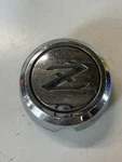 Nissan Z Center Cap (P10264) 40343 P0000. Fixed Price $20.00.