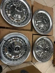 4-THUNDERBIRD Wire Wheelcovers Nos. 1974-1976. Hollander 727 D4SA-1130-AA. Fixed Price $800.00.