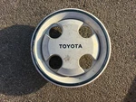 (1) Vintage 1983-1985 Toyota Tercel White, Blue Center Cap Part# 6139, Oem. Fixed Price $15.00.