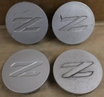 Oem Used Set Nissan 300ZX 350Z Center Caps 4034240P01 62260 62289. Fixed Price $34.95.