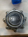 2000 Ford Excursion Center Cap #F81A-1A096-BB/ #F81A-1A096-CA. Fixed Price $20.00.