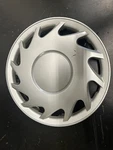 One 1994 Mitsubishi Mirage # 57548 14" 12 Spoke Wheel Cover Used. Fixed Price $15.00.
