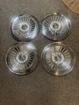 Set Of Four 1957 Ford Galaxie Fairlane T-bird Wheel Covers. Fixed Price $150.00.